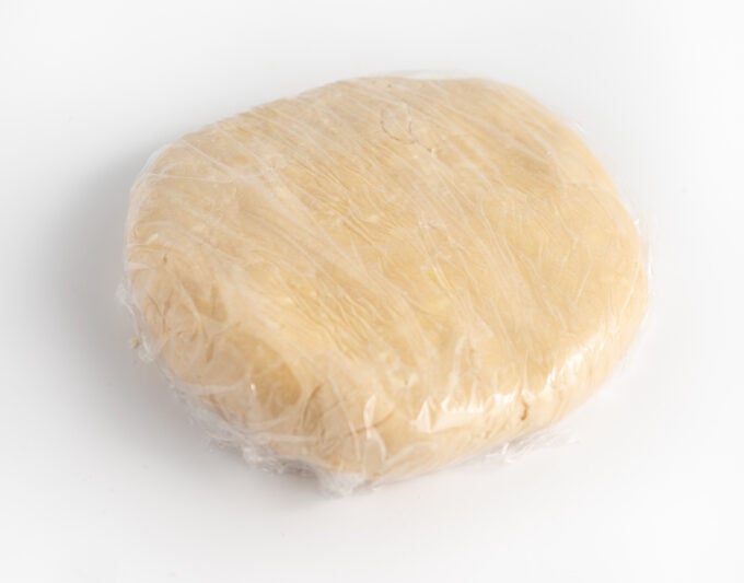 sugar cookie dough wrapped in saran wrap