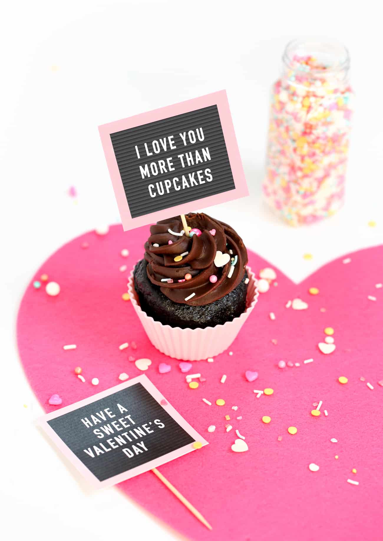 Chocolate cupcakes with Free Printable Valentine Cupcake Toppers - mini pink letterboards!
