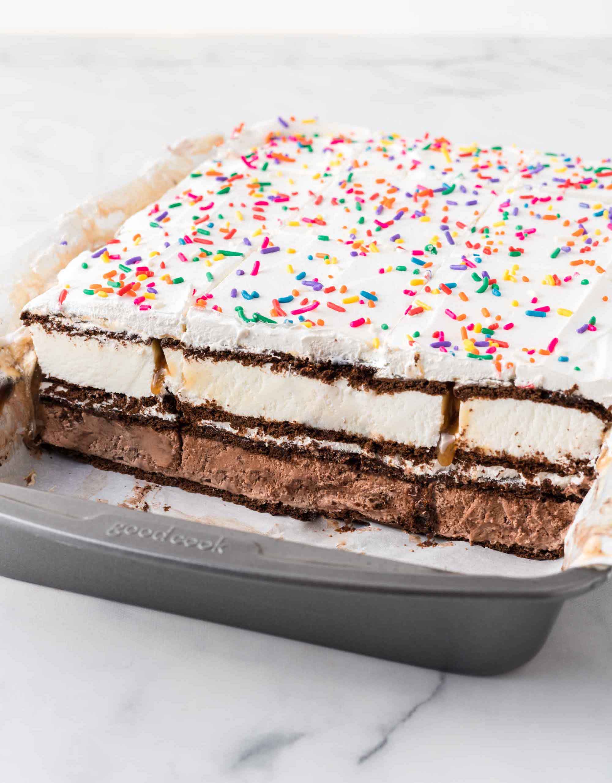 Cut ice cream sandwich cake in pan, showing layers
