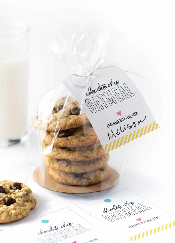 Stack of chocolate chip oatmeal cookies in plastic bag tied closed with a tag that says "chocolate chip oatmeal cookies, homemade with love from Melissa"