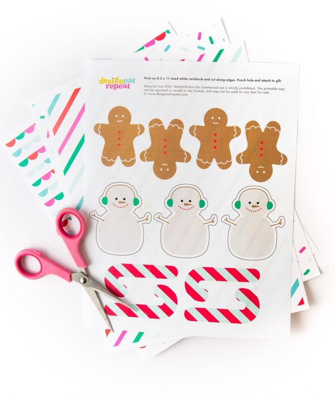 Printed sheet of Snowman, gingerbread man, and candy cane printable Christmas gift tags