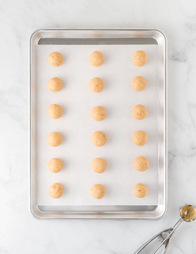 tray of frozen sugar cookie balls before dipping